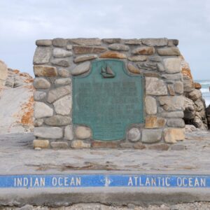 The stone cairn and ocean-boundary plaque marking the southernmost point of Africa at Cape Agulhas