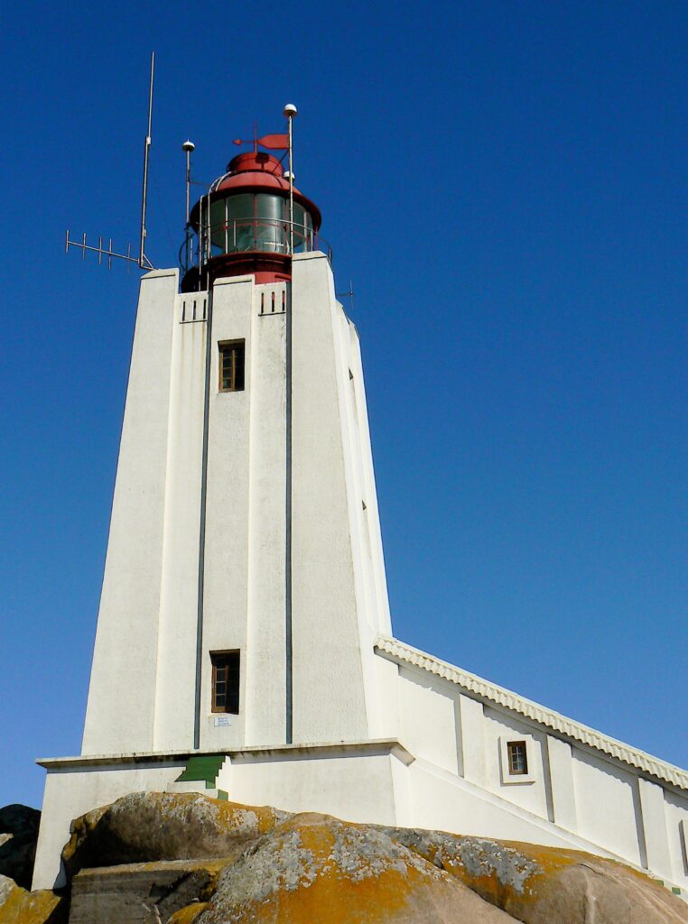 The squat white tower of Cape Columbine lighthouse on Castle Rock near Paternoster