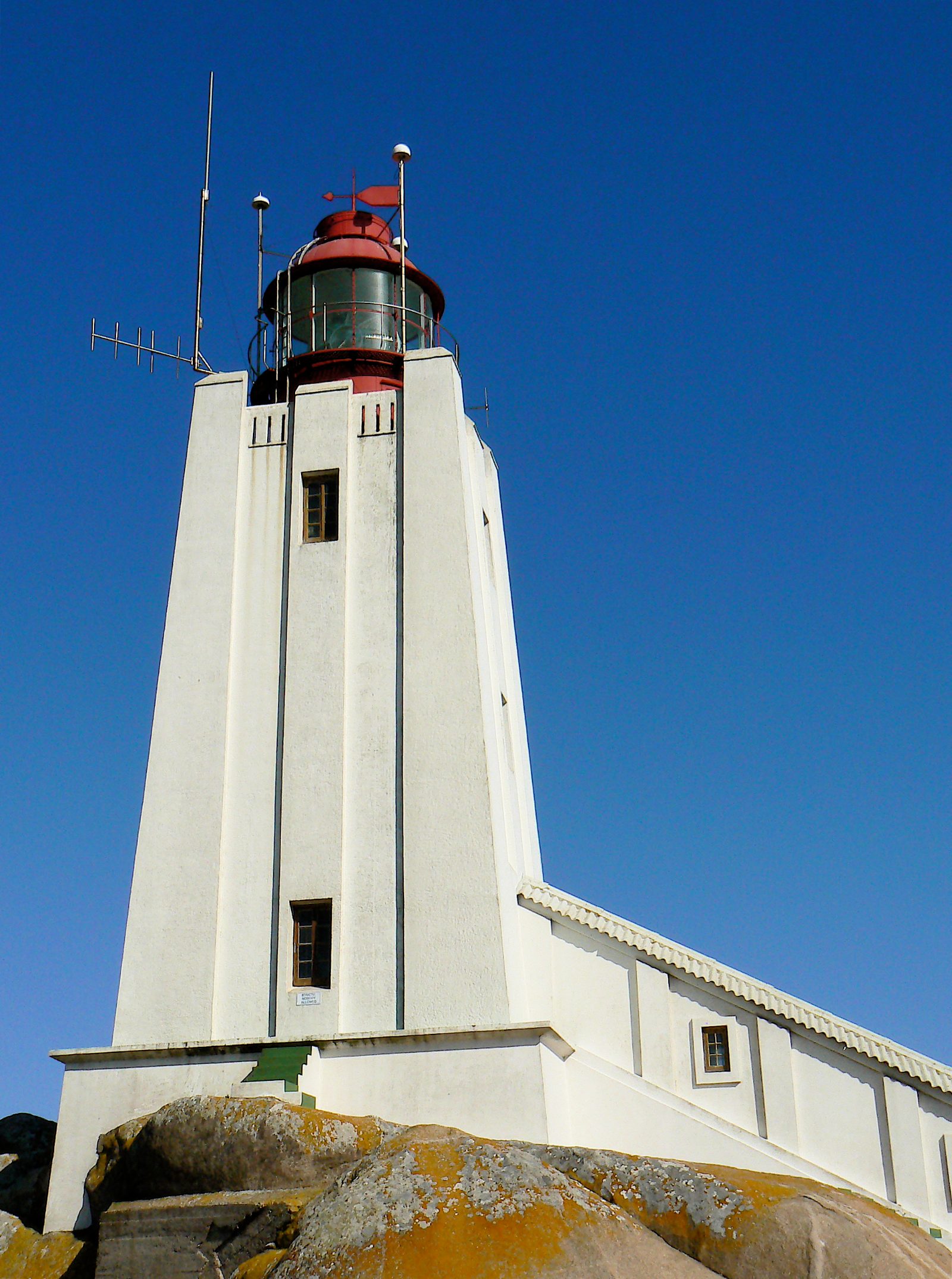 The squat white tower of Cape Columbine lighthouse on Castle Rock near Paternoster