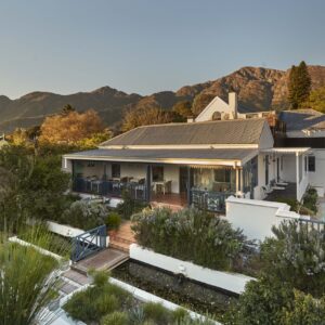 Chapter House Boutique Hotel and courtyard pool below the Franschhoek mountains