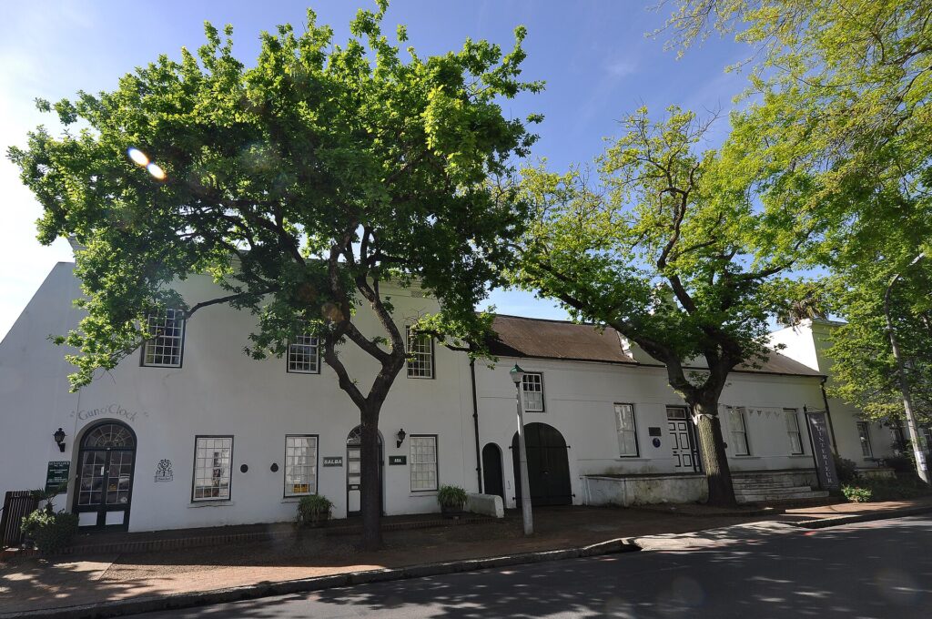 Cape Dutch buildings under oak trees on Dorp Street, Stellenbosch