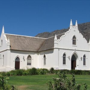 The gabled Dutch Reformed church on the main street of Franschhoek below the valley mountains