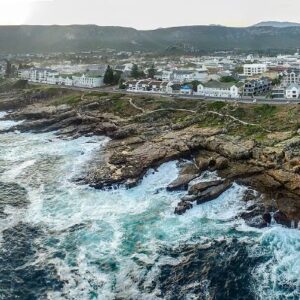 The rocky Hermanus shoreline and cliff path looking along Walker Bay
