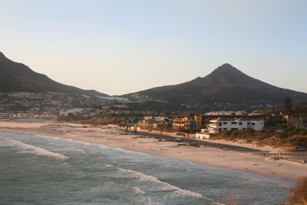 Hout Bay beach at dusk with the Sentinel peak rising above the bay