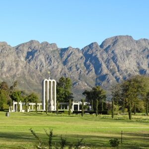 The three arches of the Huguenot Monument in Franschhoek below the valley mountains