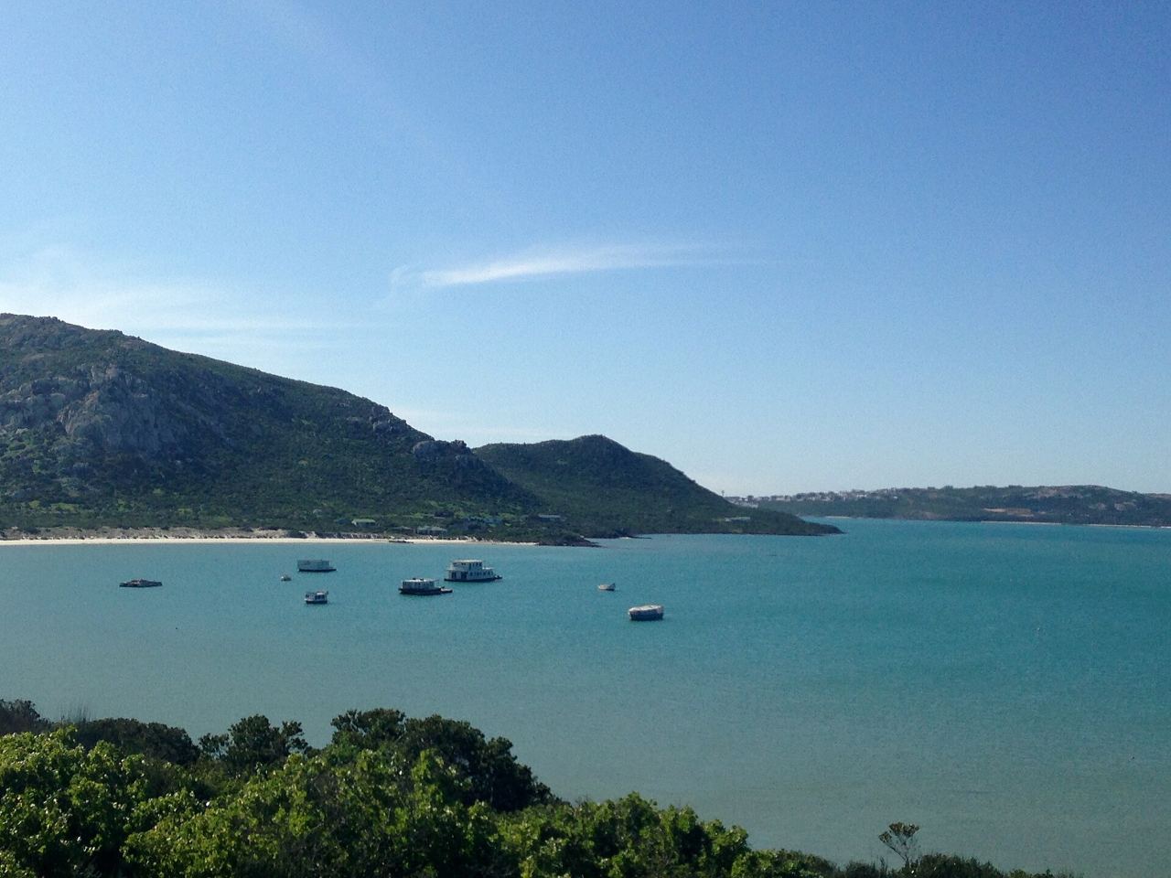Boats moored on the turquoise Langebaan Lagoon inside West Coast National Park