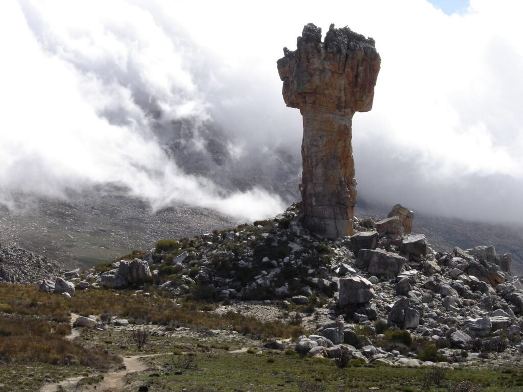The Maltese Cross rock pillar standing in cloud on the Cederberg plateau
