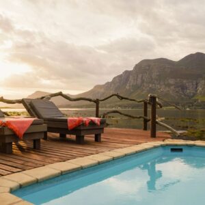 Pool deck at Mosaic Lagoon Lodge looking over the Klein River lagoon to the Kleinrivier mountains