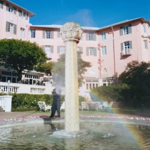 The pink facade and palm-lined lawns of the Mount Nelson Hotel in Gardens, Cape Town