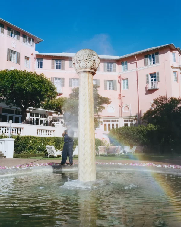 The pink facade and palm-lined lawns of the Mount Nelson Hotel in Gardens, Cape Town