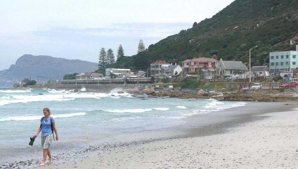 Learner surfers in the shallow whitewater at Surfers Corner, Muizenberg