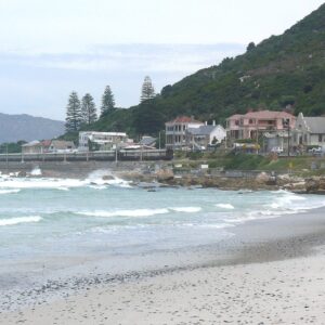 Learner surfers in the shallow whitewater at Surfers Corner, Muizenberg