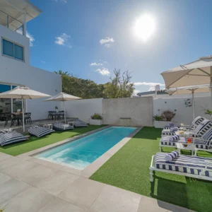 Courtyard pools and loungers at One Marine Drive Boutique Hotel in Hermanus