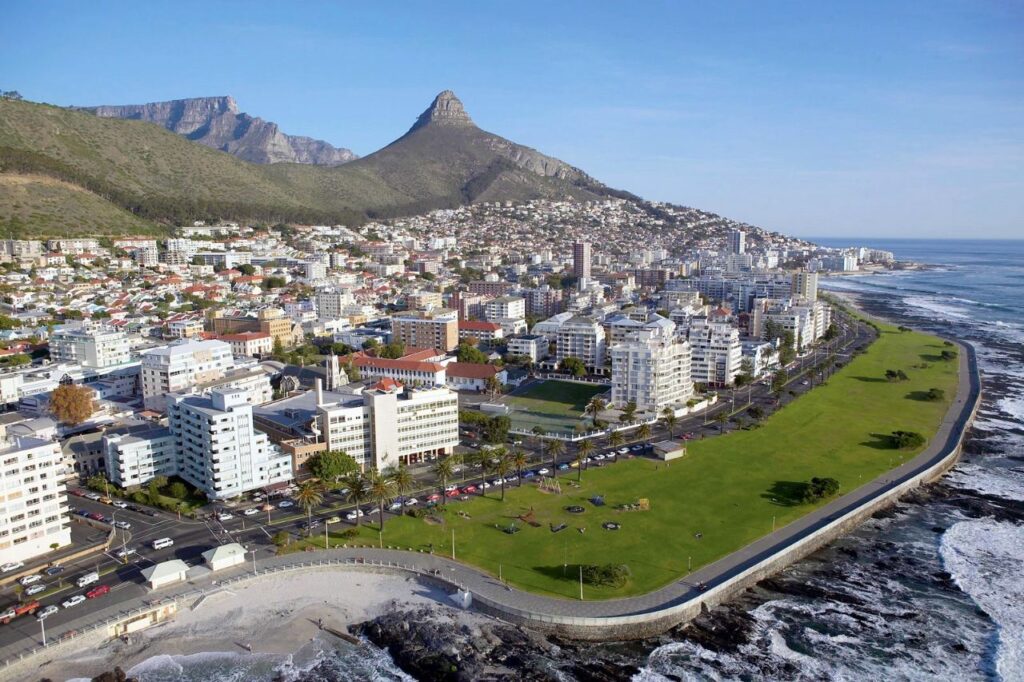The grass promenade and apartment blocks running along the Atlantic shoreline at Sea Point, Cape Town