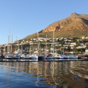 Yachts moored in Simon’s Town marina below the mountains of the southern peninsula