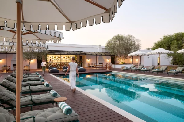 The pool terrace and loungers at Spier Hotel on the wine farm outside Stellenbosch at dusk