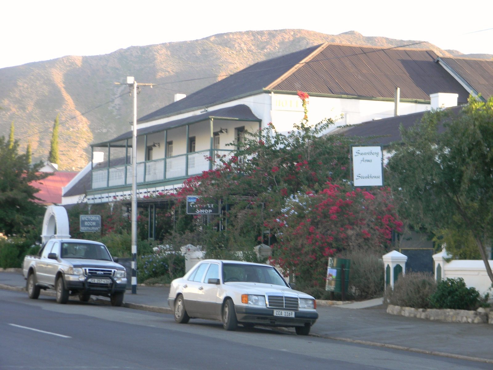 The Swartberg Hotel on the main street of Prince Albert with the mountains behind