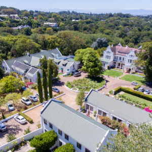 The white gabled buildings and gardens of The Cellars-Hohenort estate in Constantia, Cape Town