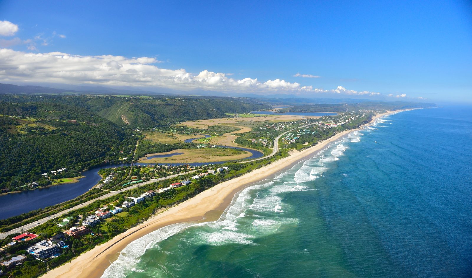 Wilderness seen from above, with the long beach, the lagoon and the N2 running behind the dunes