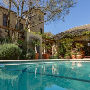 A swimming pool in front of a house at 10 Alexander B&B in Stellenbosch