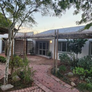 A house with a brick walkway in front of it at 150 on Retief in Paarl