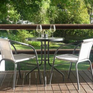 Two chairs and a table on a deck at 62 on Adderley in George