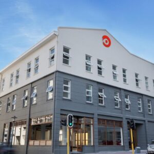 A building on a city street with a green traffic light at 91 Loop Boutique Hostel in Cape Town