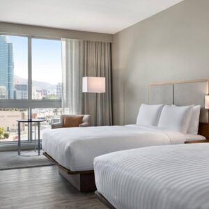 A hotel room with two beds and a window at AC Hotel by Marriott Cape Town Waterfront in Cape Town