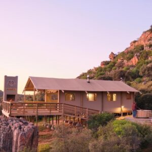 A house with a mountain in the background at AfriCamps at de Pakhuys, Cederberg in Cederberg
