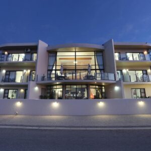A large building with lights in front of it at Bar-t-nique Guest House in Mossel Bay