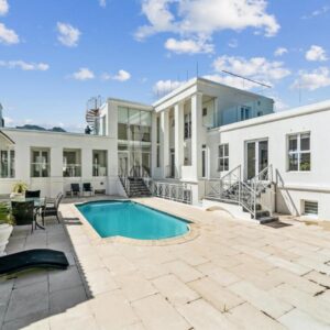 An exterior view of a house with a swimming pool at Bed and Breakfast Villa Livadia in Cape Town