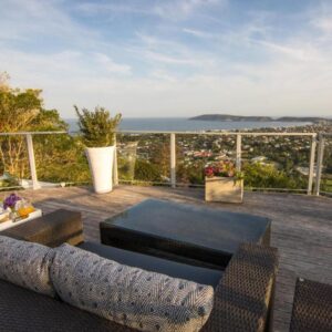 A patio with a view of the ocean at Bosavern Guest House in Plettenberg Bay