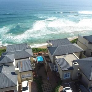 An aerial view of houses and the ocean at Brenton On The Rocks in Knysna
