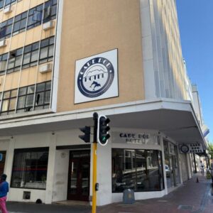 A traffic light in front of a building at CapePod City Centre in Cape Town