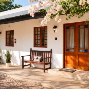 A porch with a bench and a wooden door at Cedar Stay Clanwilliam in Clanwilliam