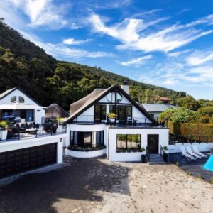 An aerial view of a house with a swimming pool at Cloverleigh Guest House in Wilderness