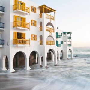A building on the beach next to the ocean at Club Mykonos Langebaan in Langebaan