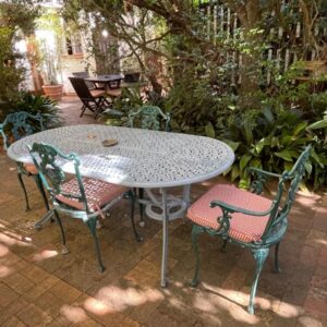 A table and chairs sitting on a patio at Constantia Guest House in Cape Town