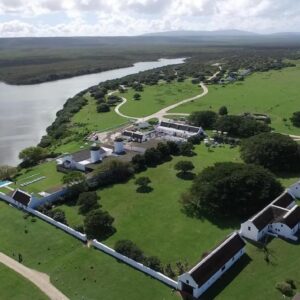 An aerial view of a house next to a river at De Hoop Collection in De Hoop Nature Reserve