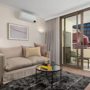 A living room with a couch and a table at Dolce Vita Apartments by Propr in Cape Town