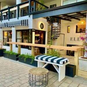 A bench sitting in front of a building at Eleven in Plettenberg Bay