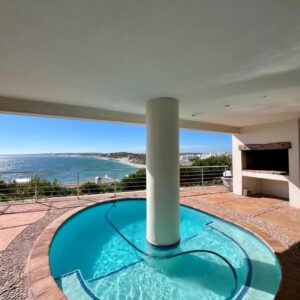 A circular pool in the middle of a house at Endless blue ocean view escape in Langebaan