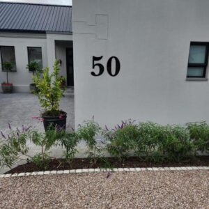 A white building with the number on it at Fifty Ridge in George