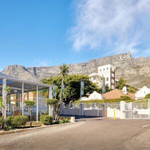 A view of a building with a mountain in the background at First Group Mount Sierra in Cape Town