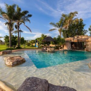 A large swimming pool with a spa in a resort at Formosa Bay in Plettenberg Bay