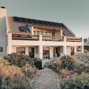 A house with solar panels on its roof at Gonana Guesthouse in Paternoster