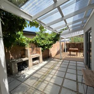 A pergola on a house with a patio at Guest cottage in Plettenberg Bay