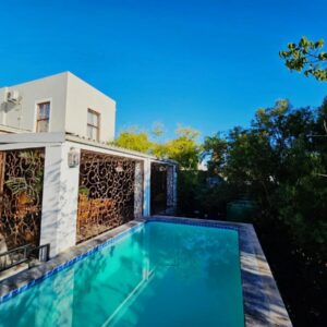 A swimming pool in the backyard of a house at Haus Müller in Clanwilliam