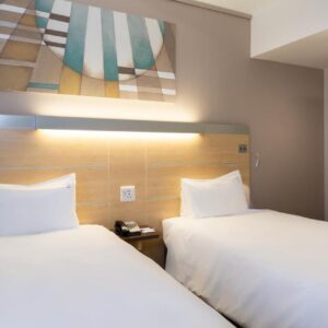 Two beds sitting next to each other in a room at Holiday Inn Express Cape Town City Centre by IHG in Cape Town