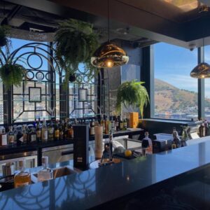 A bar with a view of a city at Hotel Sky Cape Town in Cape Town